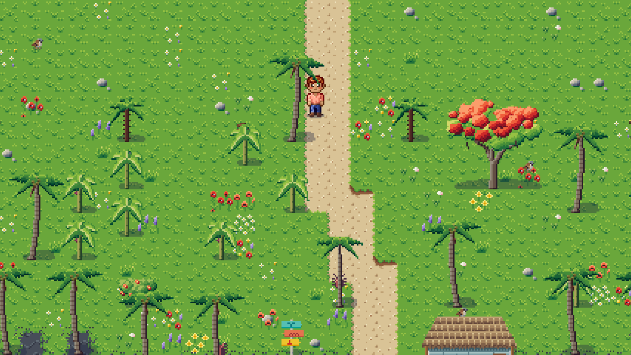Palm trees and a flowering red tree along a sandy path on a green island.