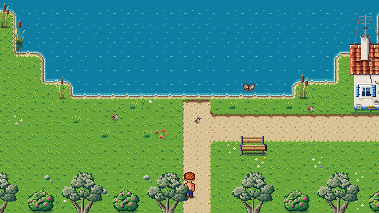 A blue lake with reeds, a bench by the path and olive trees along the shore.